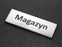 Tabliczka na drzwi z nazwą pomieszczenia MAGAZYN